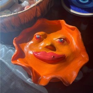 Orange sun face ashtray and incense burner